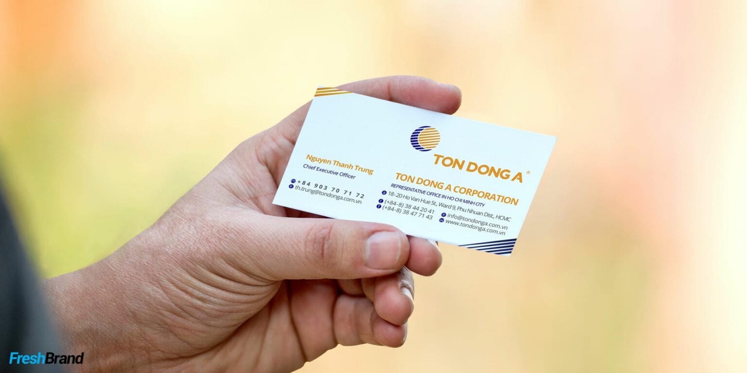 A Ton Dong A business card in hand